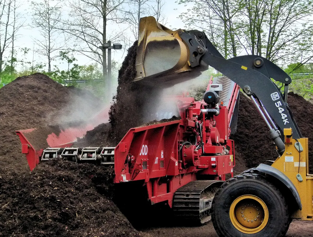 Loader handling demolition debris for sorting and disposal